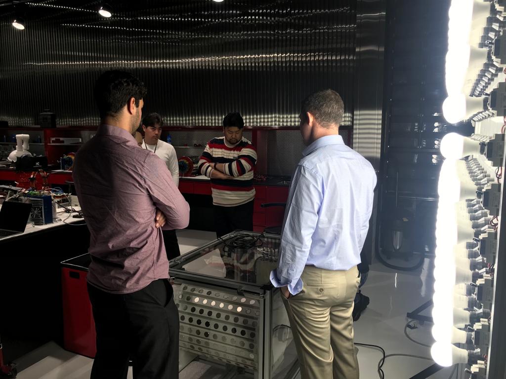 The team examines Andrii's equipment in the South Korean laboratory — January 2020