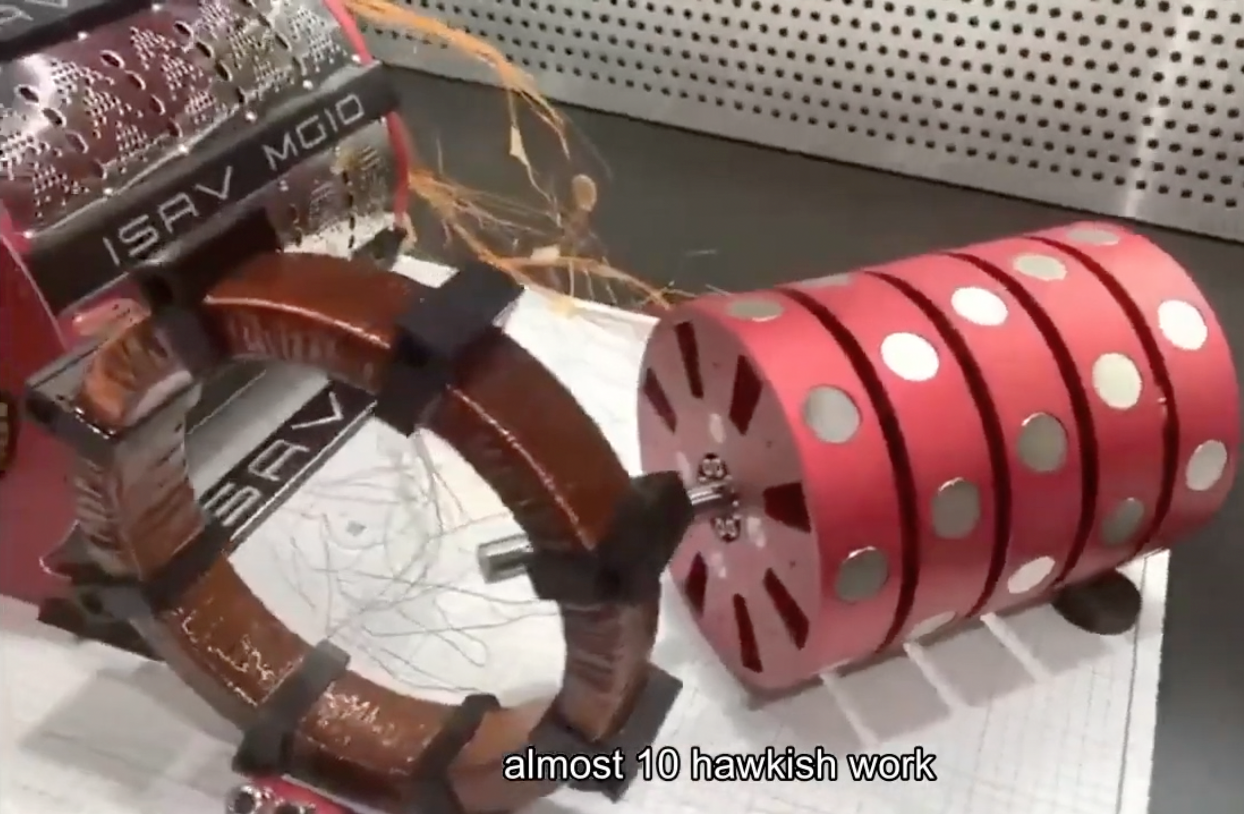 The ISAV MG10 device — close-up showing the branded motor-generator assembly with magnetic rotor